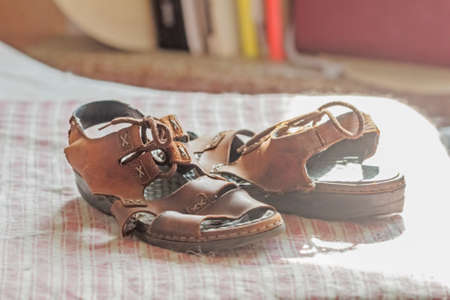 Real light brown old women's sandals like symbol of historyの写真素材
