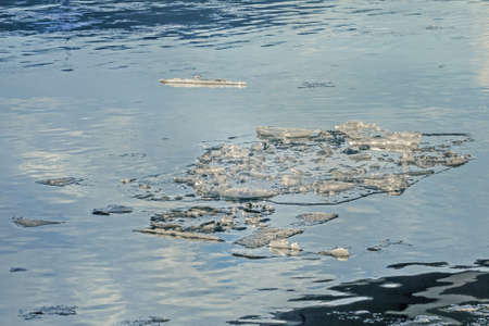 Real beauty ice on blue water on sunny spring dayの写真素材