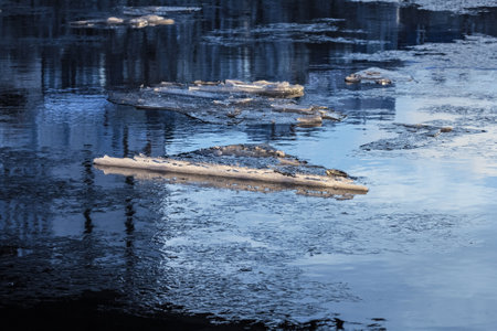 Real charming ice floes in winter blue-blue water at winter day