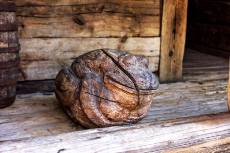 Real pretty wooden toad figurine in relaxation for good moodの写真素材