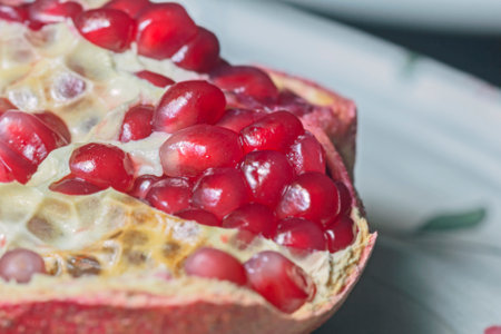 Pretty fresh ripe pomegranate seeds for tasty eating and good moodの写真素材