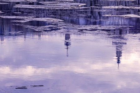 Real pretty reflection in winter river water as symbol of creativeの写真素材