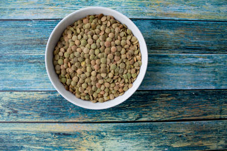 white dishes on a turquoise backgroundの写真素材