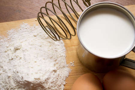 cup of milk, flour and two eggsの写真素材