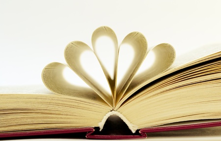 an open book lying on the tableの写真素材