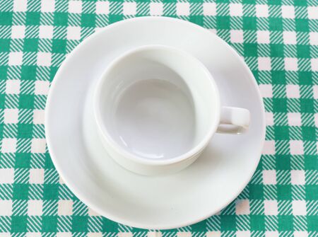 white coffee pair on checkered tablecloth