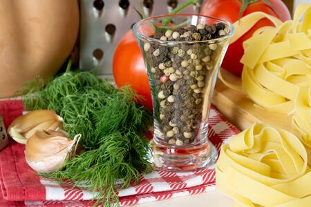 Ingredients for cooking pasta with tomatoes and herbsの写真素材
