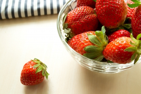 Strawberries in a glass on the tableの写真素材