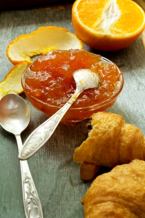 orange jam and croissants on the tableの写真素材