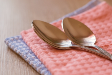 spoon lying on a towelの写真素材