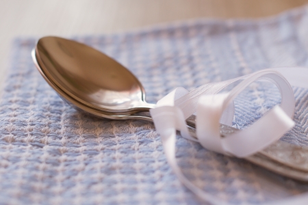 spoon lying on a towelの写真素材