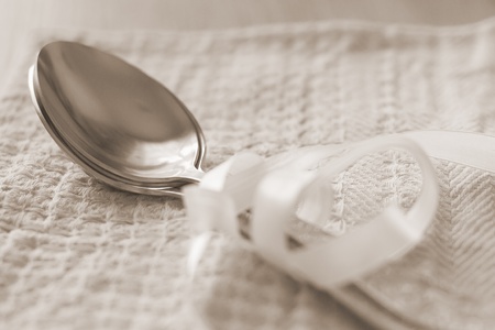 spoon lying on a towelの写真素材