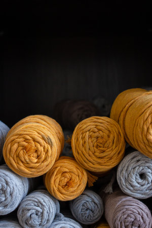 Multicolored cotton balls of yarn and ropes for macrame close up, handmade threads, texture of material, crocheting and knitting hobby, handicraft lifestyleの写真素材