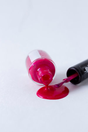 Pink nail polish on white background isolated, vibrant dropの写真素材