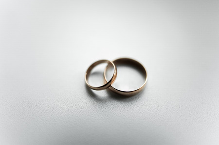 Hands of newlyweds with rings on unusual wedding bouquet.の写真素材