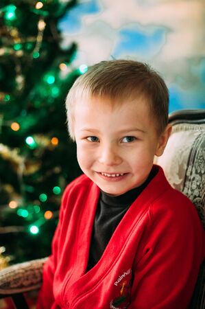 Portrait of adorable boy with giftboxesの写真素材