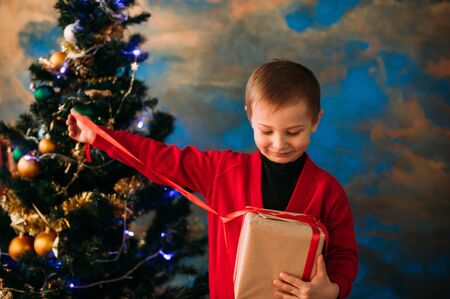 Portrait of adorable boy with giftboxesの写真素材