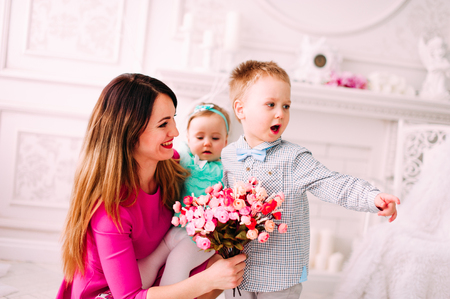 Portrait of a happy mother and her children in studioの写真素材