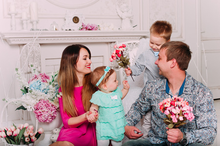 Beautiful family portrait spending time together at studioの写真素材