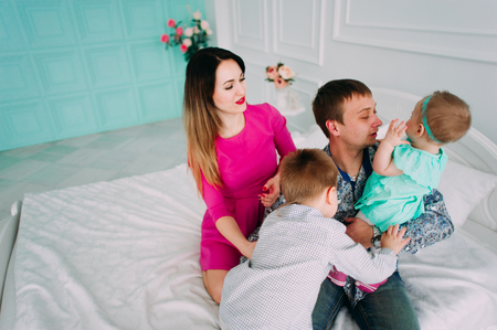 Beautiful family portrait spending time together at studioの写真素材