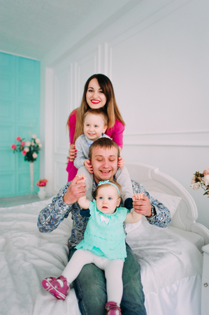 Beautiful family portrait spending time together at studioの写真素材