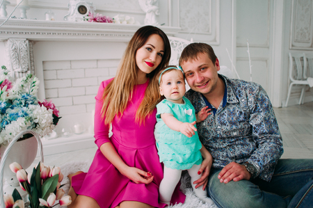 Beautiful family portrait spending time together at studioの写真素材