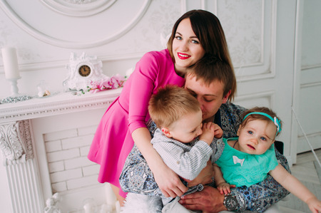 Beautiful family portrait spending time together at studioの写真素材