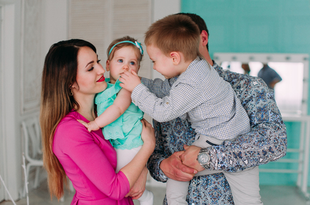 Beautiful family portrait spending time together at studioの写真素材