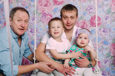 Beautiful family portrait spending time together at studioの写真素材