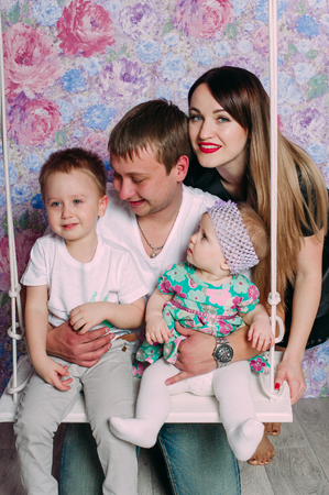 Beautiful family portrait spending time together at studioの写真素材