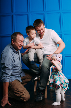 Grandfather father and son smiling and having funの写真素材