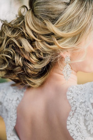 Back of beautiful bride with bridal bunch