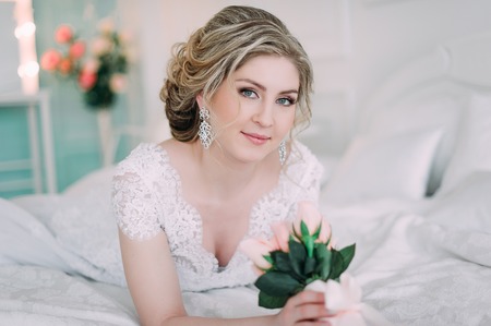 Portrait of bride in flower decor, studio photo. Beautiful Bride portrait wedding makeup and hairstyle, fashion bride model jewelry and beauty girl face, gorgeous beauty bride, studio, flower seriesの写真素材