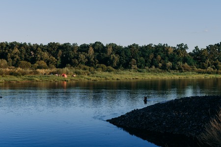 The river with a quiet current and clouds reflected in it, Soz , Gomel, Belarusの写真素材