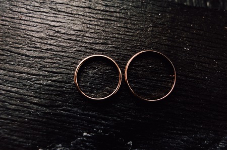 gold wedding rings on the pincushionの写真素材