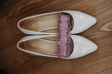 Bride accessories: lace blouse, garter, ballet flats, high-heeled shoesの写真素材