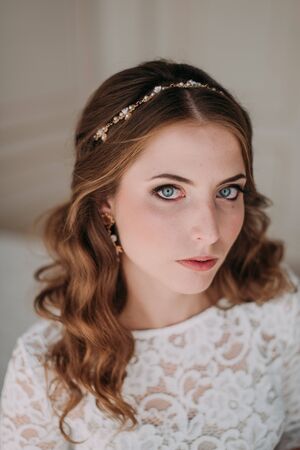 fashion studio photo of beautiful elegant bride with dark hair in luxurious wedding dressの写真素材
