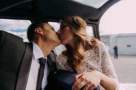Happy beautiful newlyweds near the helicopterの写真素材