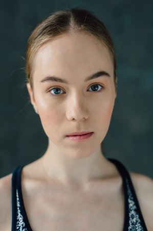 Sexual sports girl with a good body goes in for sports and youga on a dark backgroundの写真素材