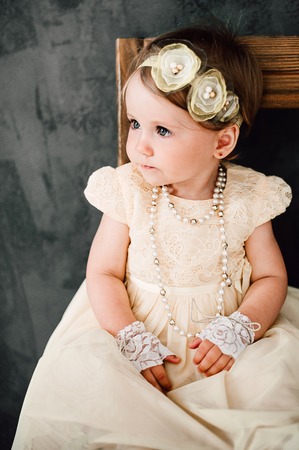 two babies - boy and girl dressed as bride and groomの写真素材
