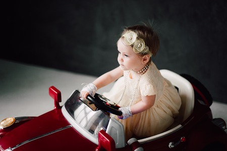 two babies - boy and girl dressed as bride and groomの写真素材