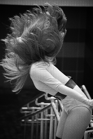 Awesome Caucasian attractive joyful happy sexy female model is shaking head with brunette hair,...