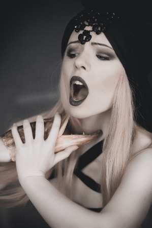 Gothic girl with fish head, emotional portraitの写真素材