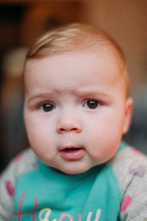 little cute baby toddler on carpet close up smiling adorable happy emotional playing at homeの写真素材