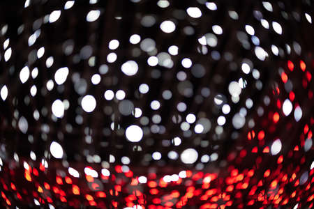 Red bokeh on a dark backgroundの写真素材