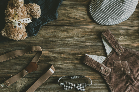 Flat lay photography of boy's casual outfits, Outfits of traveler, boy, male, Men's casual outfits on wood board background - Vintage effect style pictureの写真素材