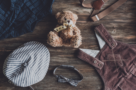 Flat lay photography of boy's casual outfits, Outfits of traveler, boy, male, Men's casual outfits on wood board background - Vintage effect style pictureの写真素材