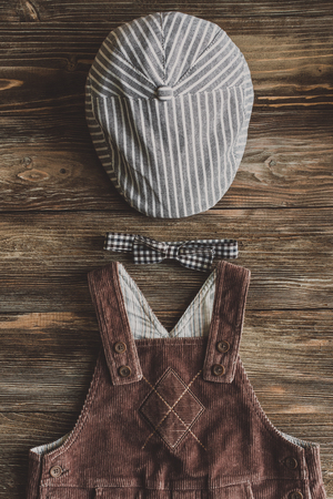 Flat lay photography of boy's casual outfits, Outfits of traveler, boy, male, Men's casual outfits on wood board background - Vintage effect style pictureの写真素材