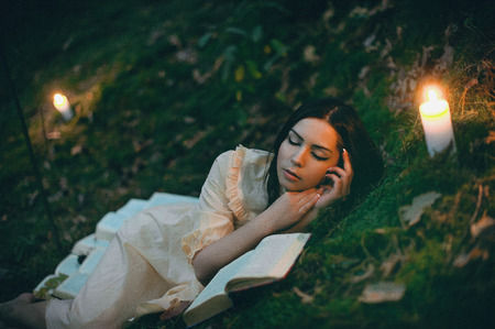 Portrait of a beautiful mysterious woman in the forest