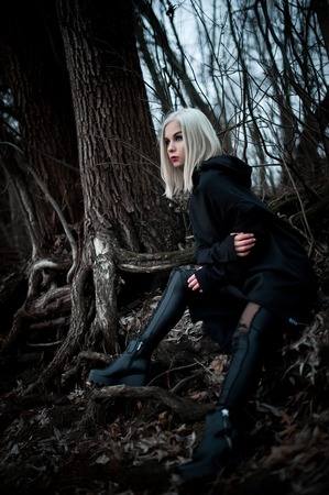 Shot of a gothic woman in a forest. Fashion.